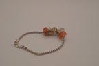 November themed silver snake-chain charm bracelet