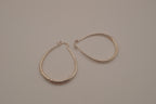 Sterling silver teardrop-shaped hoop earrings