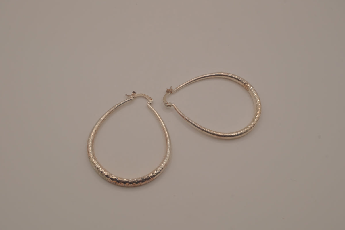 Sterling silver teardrop-shaped hoop earrings