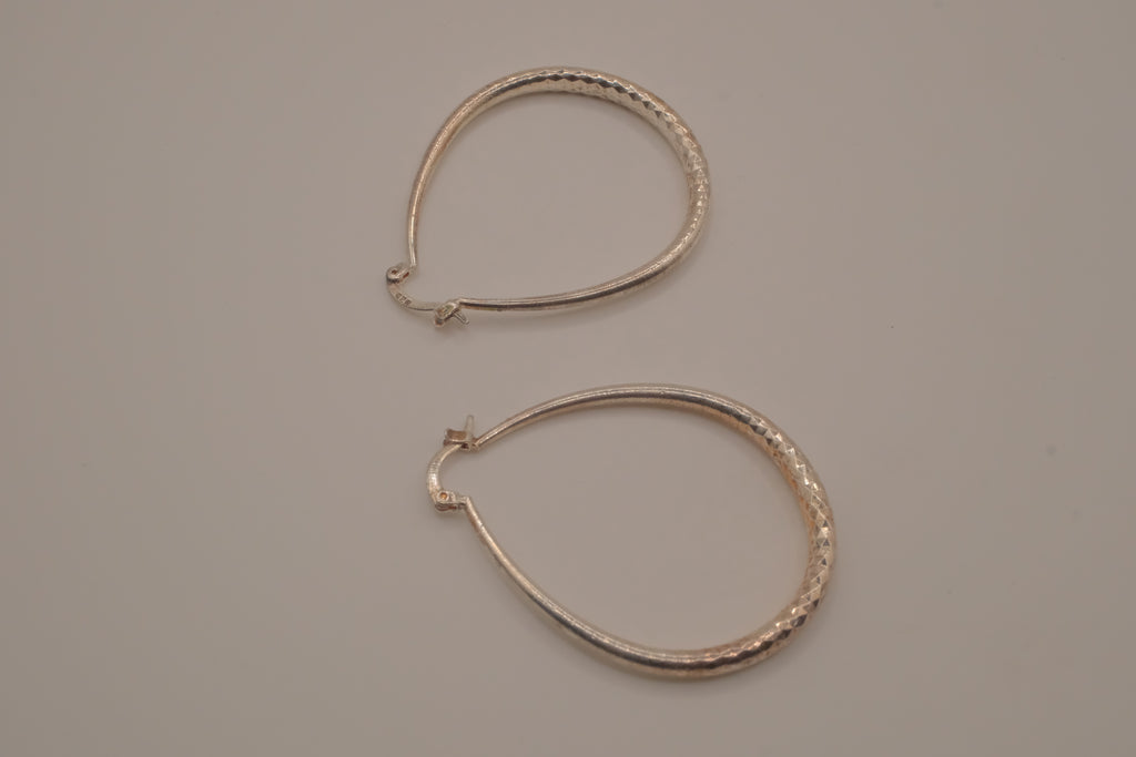 Sterling silver teardrop-shaped hoop earrings