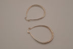 Sterling silver teardrop-shaped hoop earrings