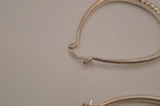 Sterling silver teardrop-shaped hoop earrings
