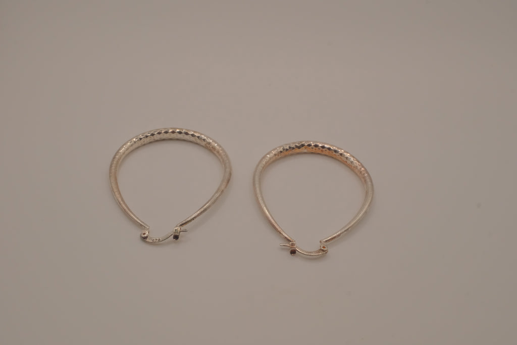 Sterling silver teardrop-shaped hoop earrings