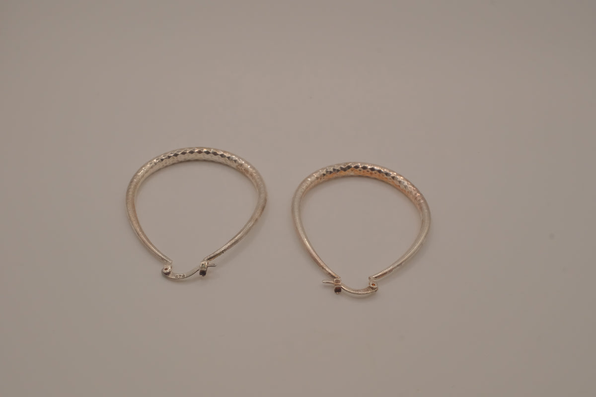 Sterling silver teardrop-shaped hoop earrings