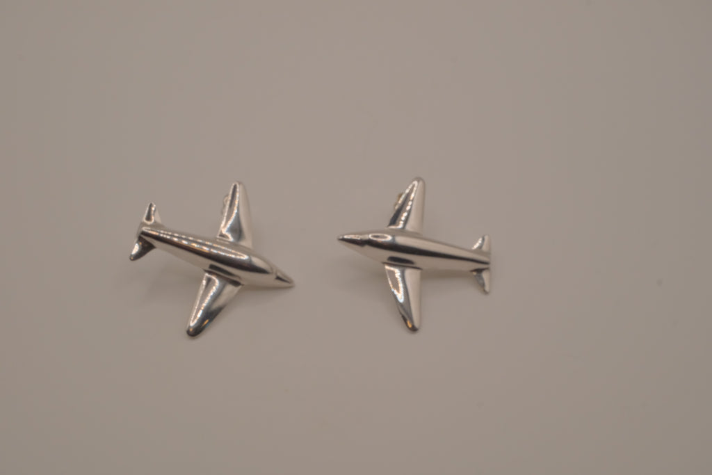 Silver-toned jet airplane-shaped earrings
