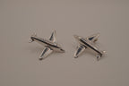 Silver-toned jet airplane-shaped earrings