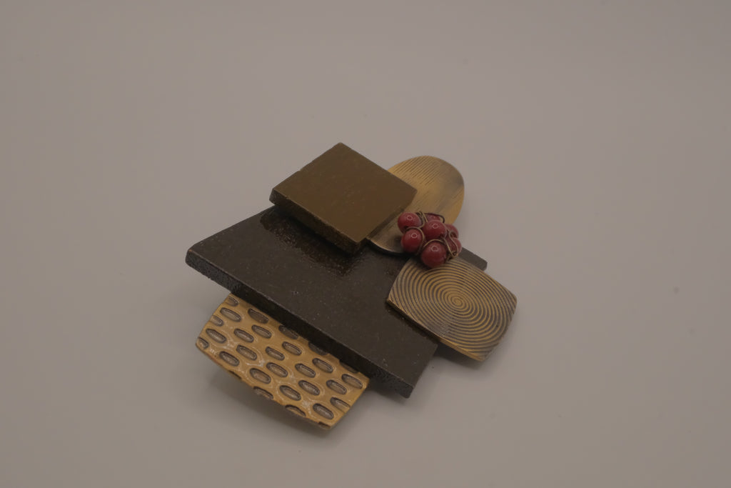 Reworked abstract mixed-metal brooch