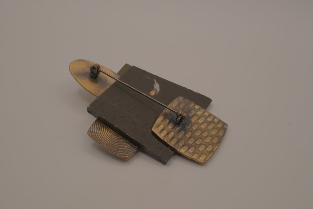 Reworked abstract mixed-metal brooch