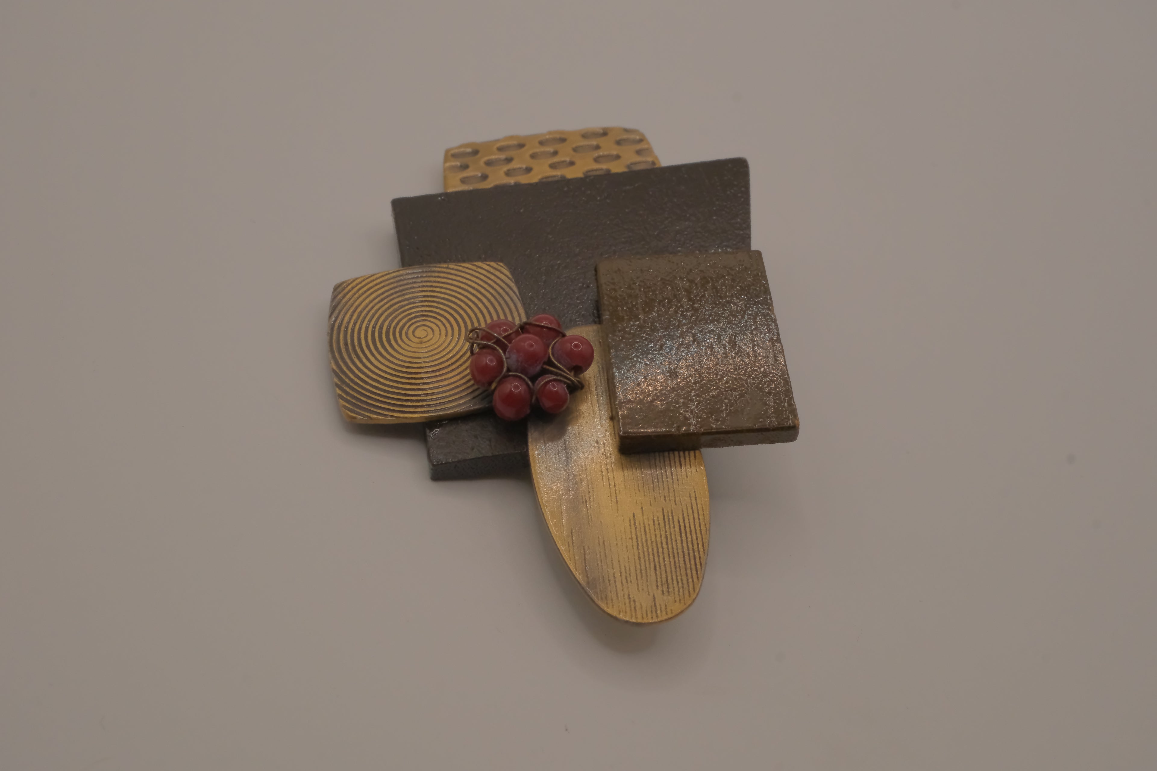 Reworked abstract mixed-metal brooch