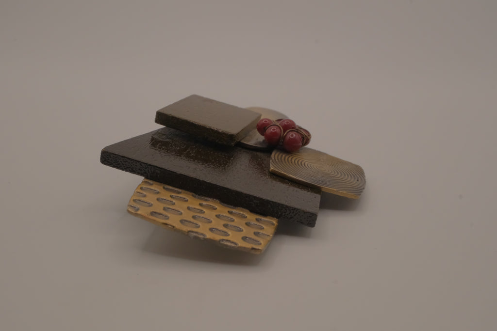 Reworked abstract mixed-metal brooch