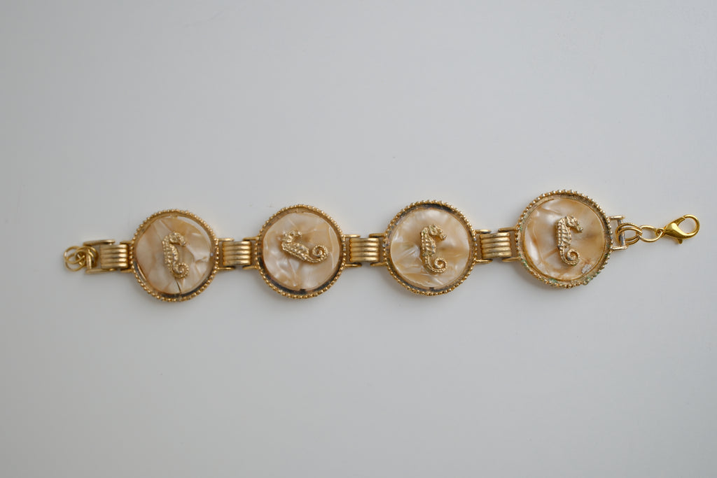 Vintage gold-tone link bracelet featuring seahorse motifs