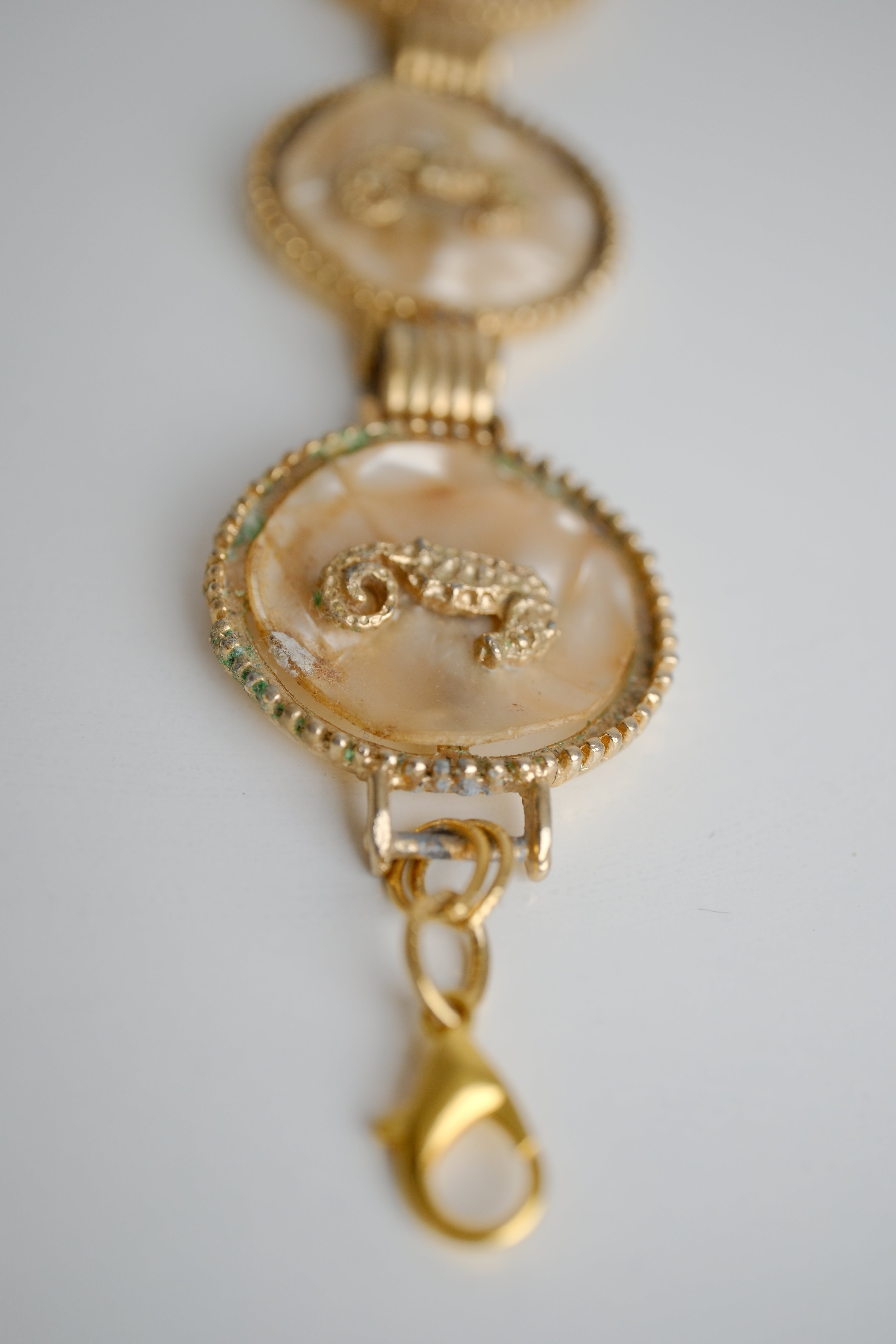 Vintage gold-tone link bracelet featuring seahorse motifs