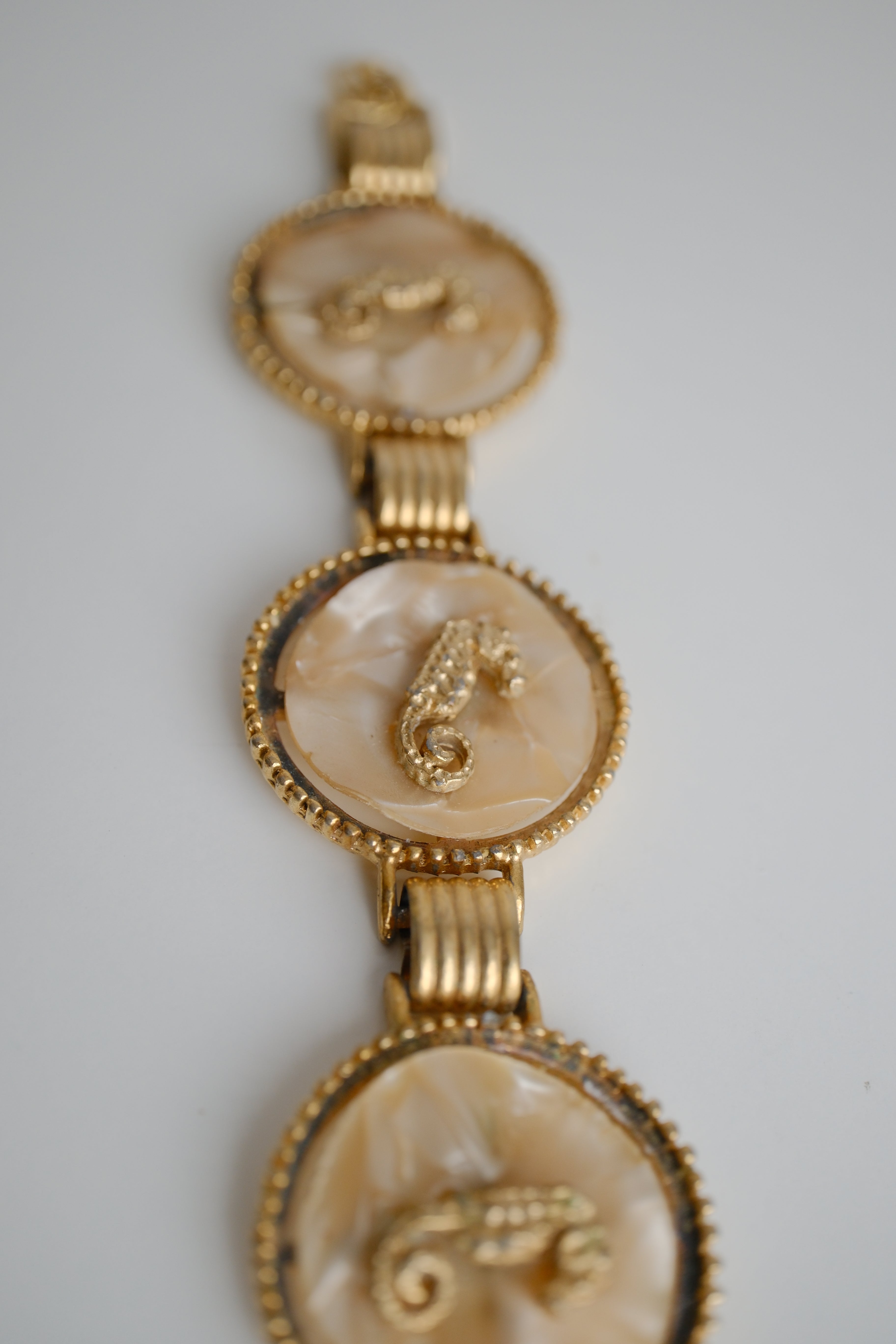 Vintage gold-tone link bracelet featuring seahorse motifs