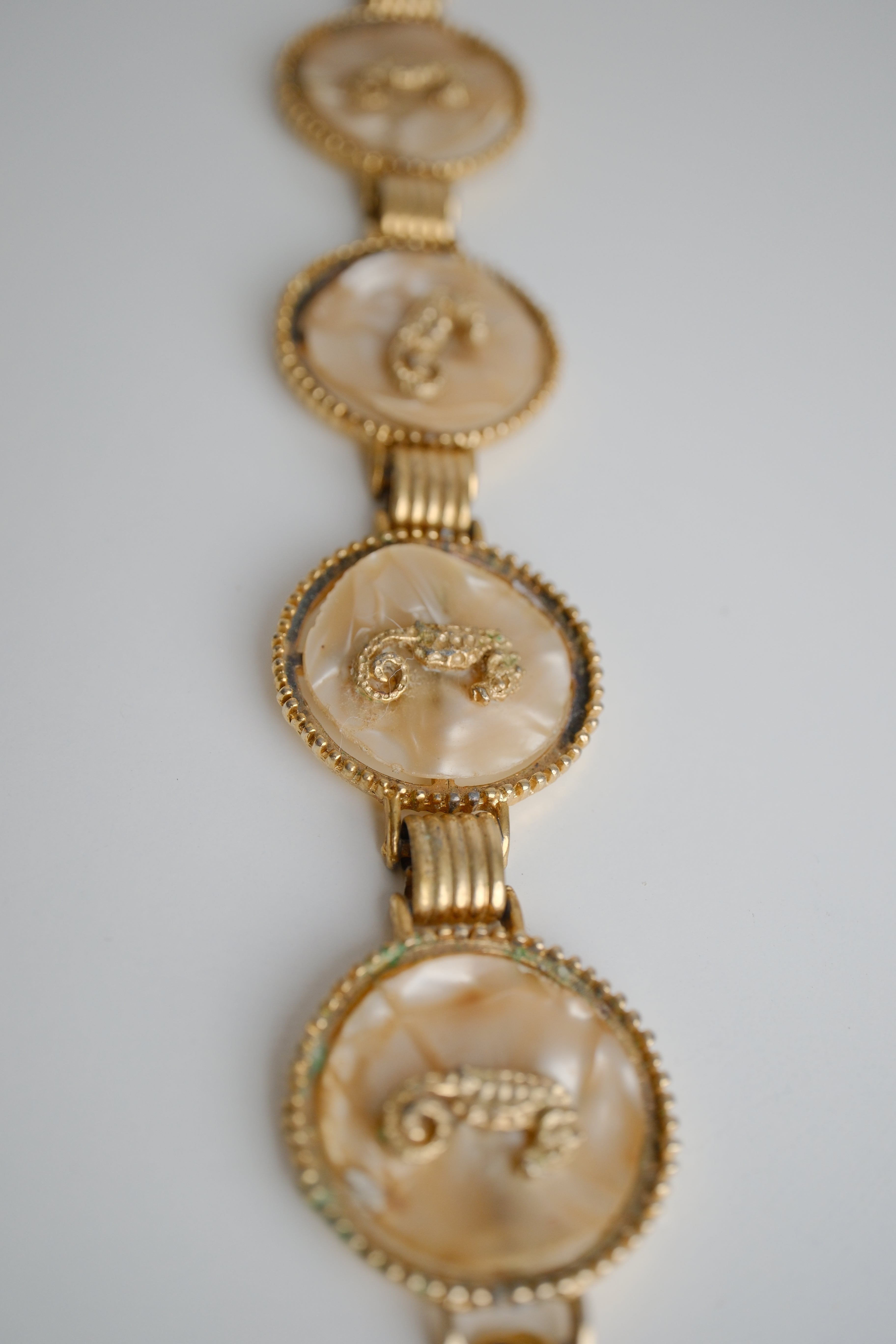 Vintage gold-tone link bracelet featuring seahorse motifs