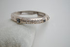 Silver toned patterned bangle with square grey stones
