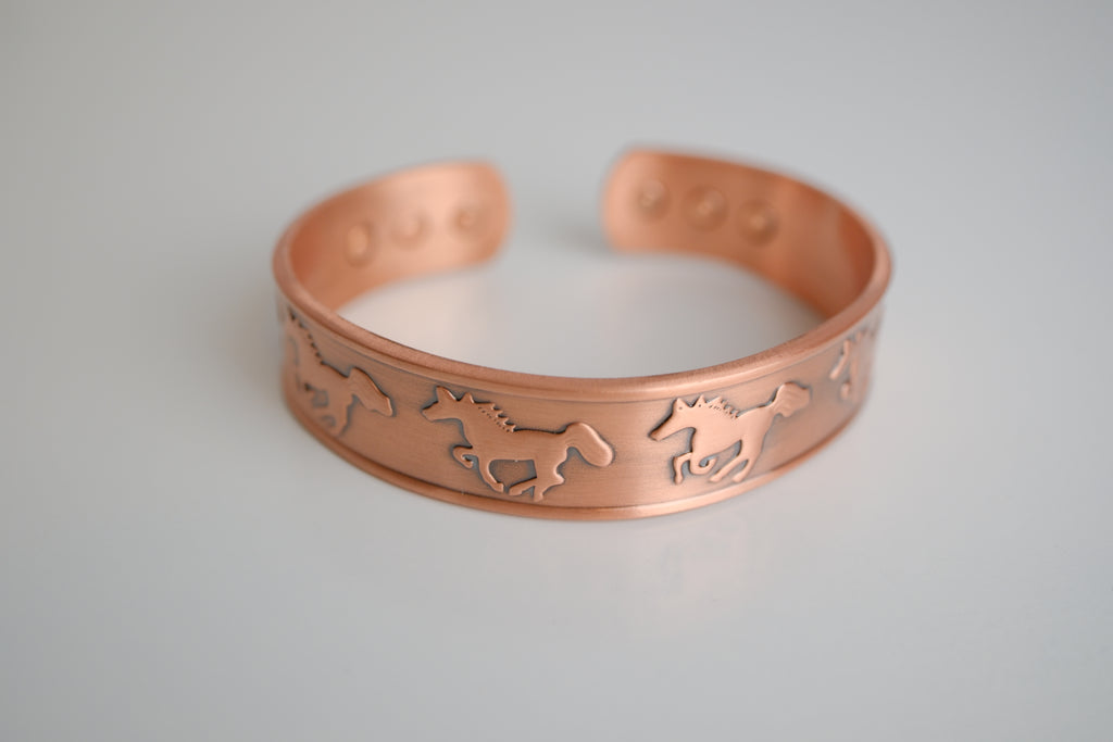 Copper cuff bracelet with engraved horse design