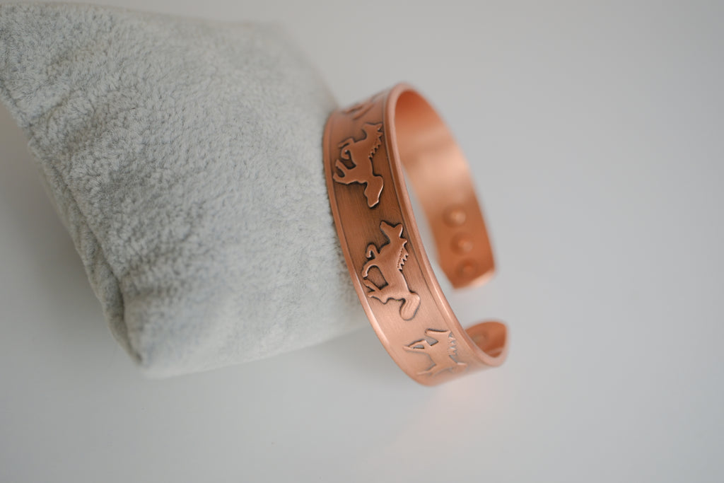 Copper cuff bracelet with engraved horse design
