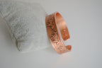 Copper cuff bracelet with engraved horse design