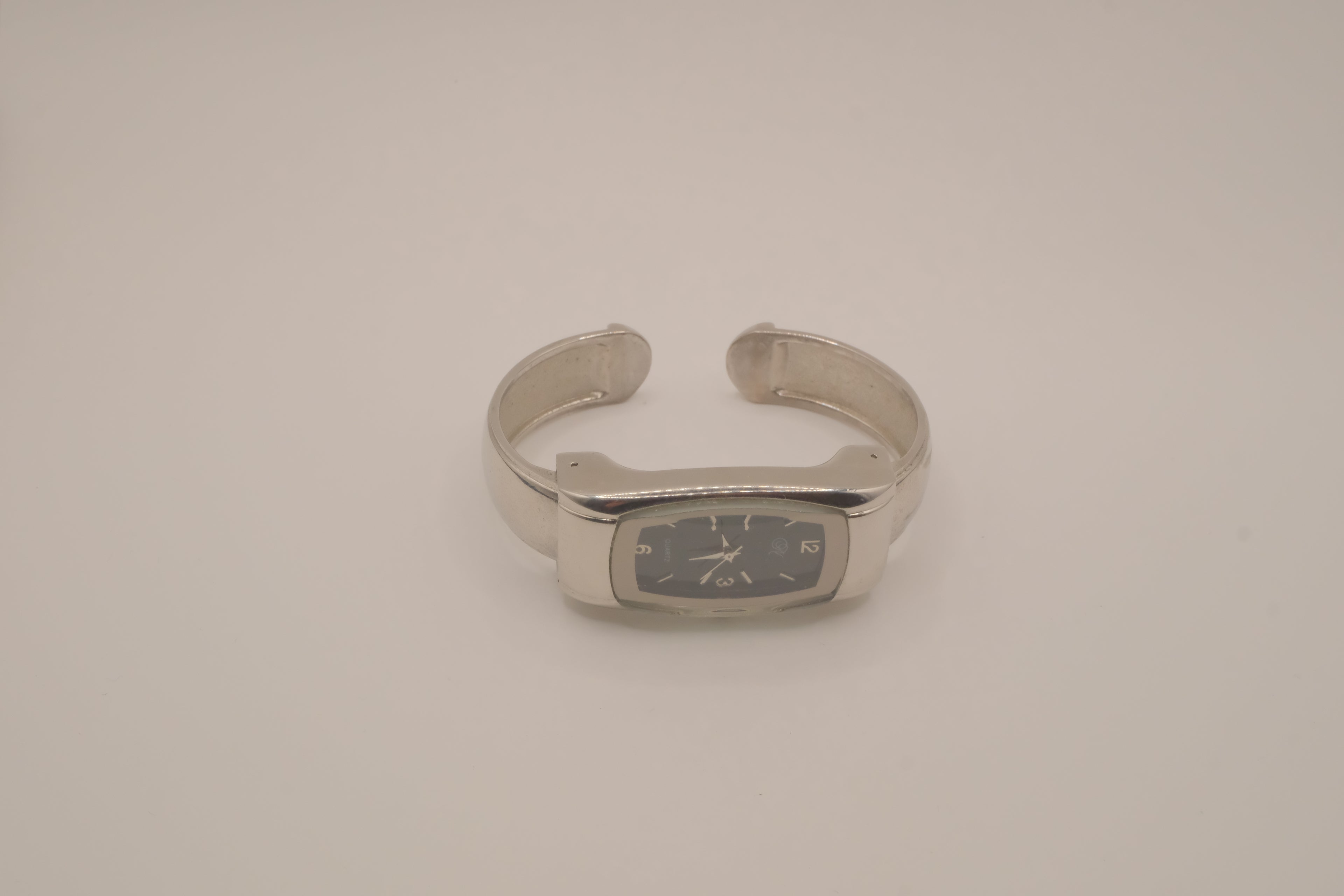 Silver tone rectangular cuff watch