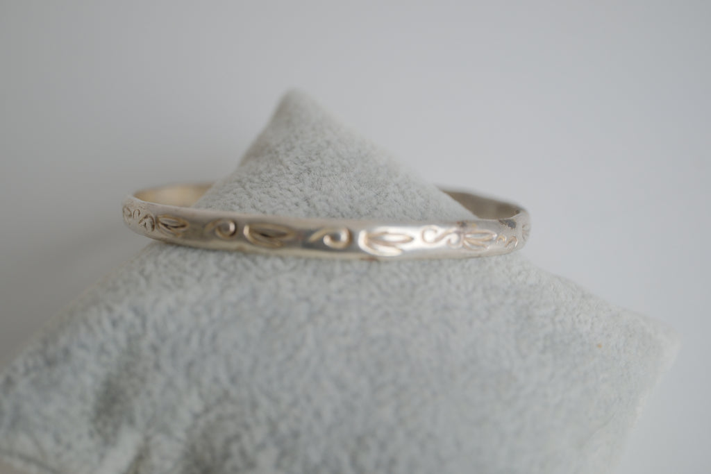 Sterling silver bangle bracelet with etched artwork