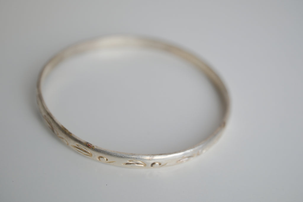 Sterling silver bangle bracelet with etched artwork
