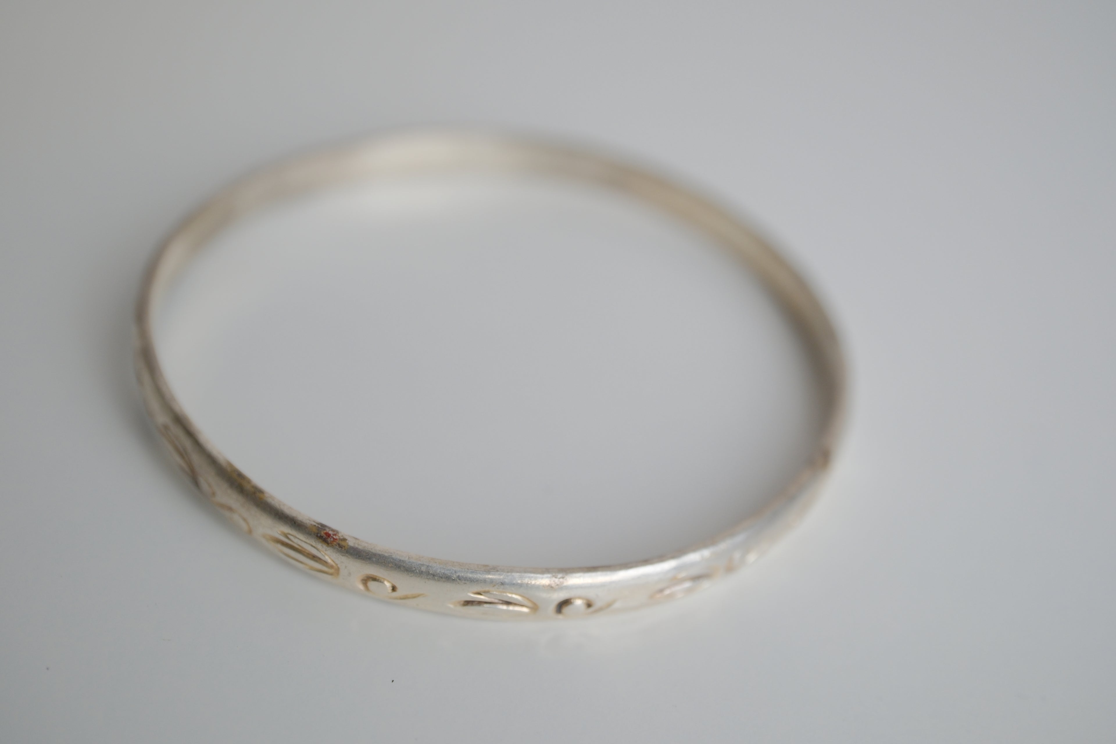Sterling silver bangle bracelet with etched artwork