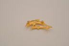 Gold-tone double dolphin brooch