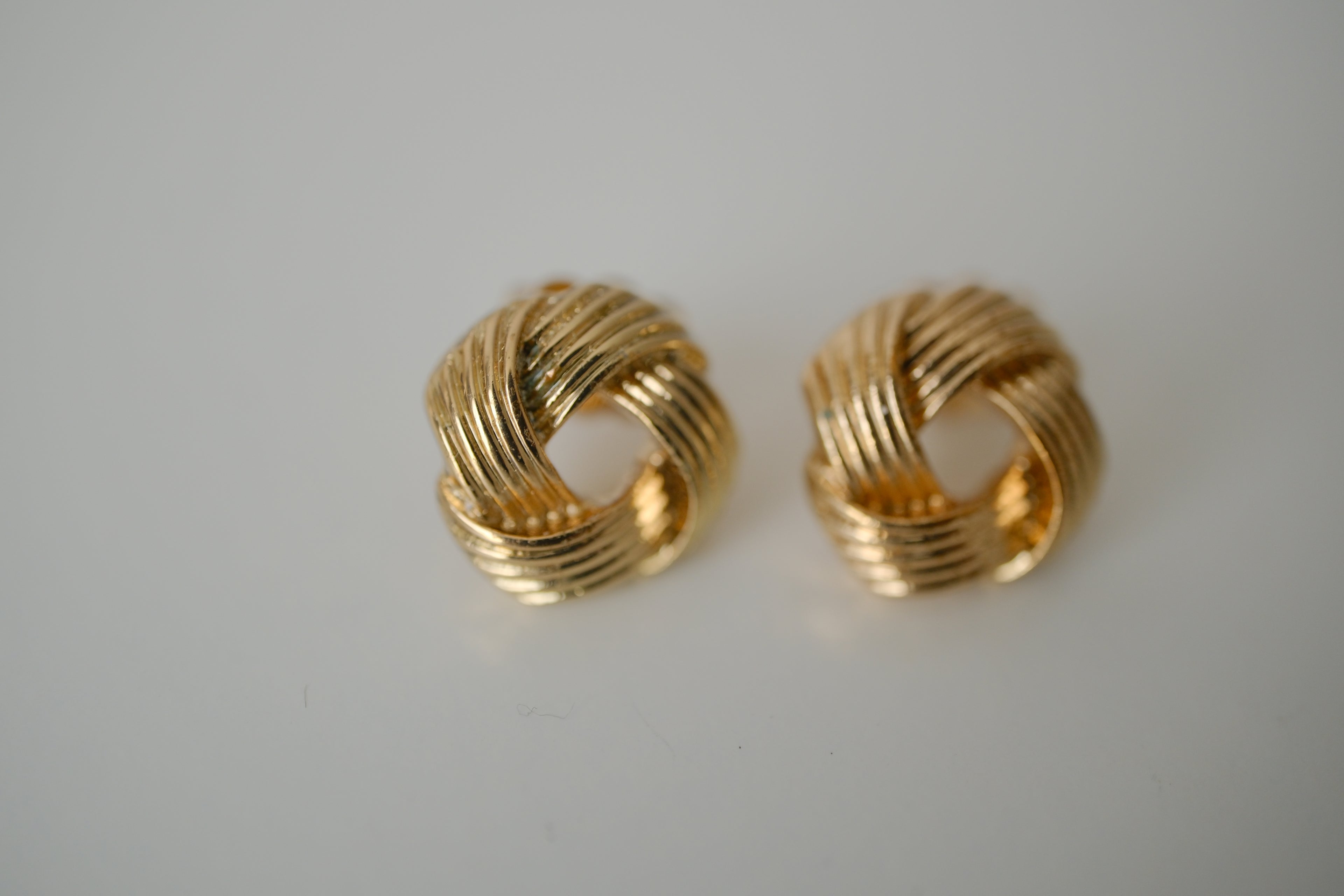Gold love knot stud earrings