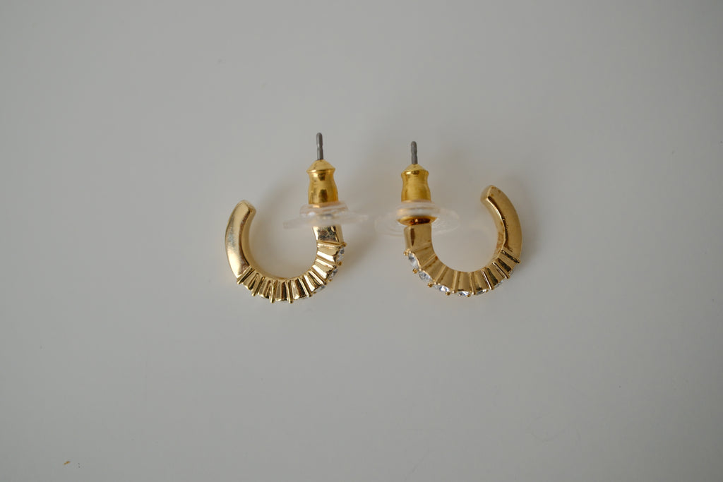 Gold curved bar stud earrings