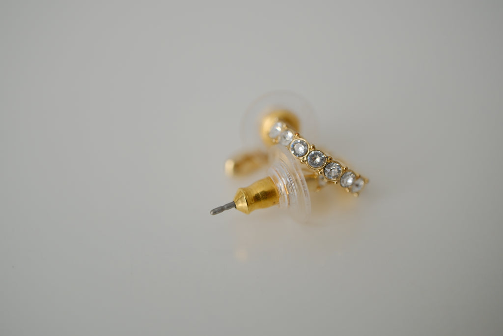 Gold curved bar stud earrings
