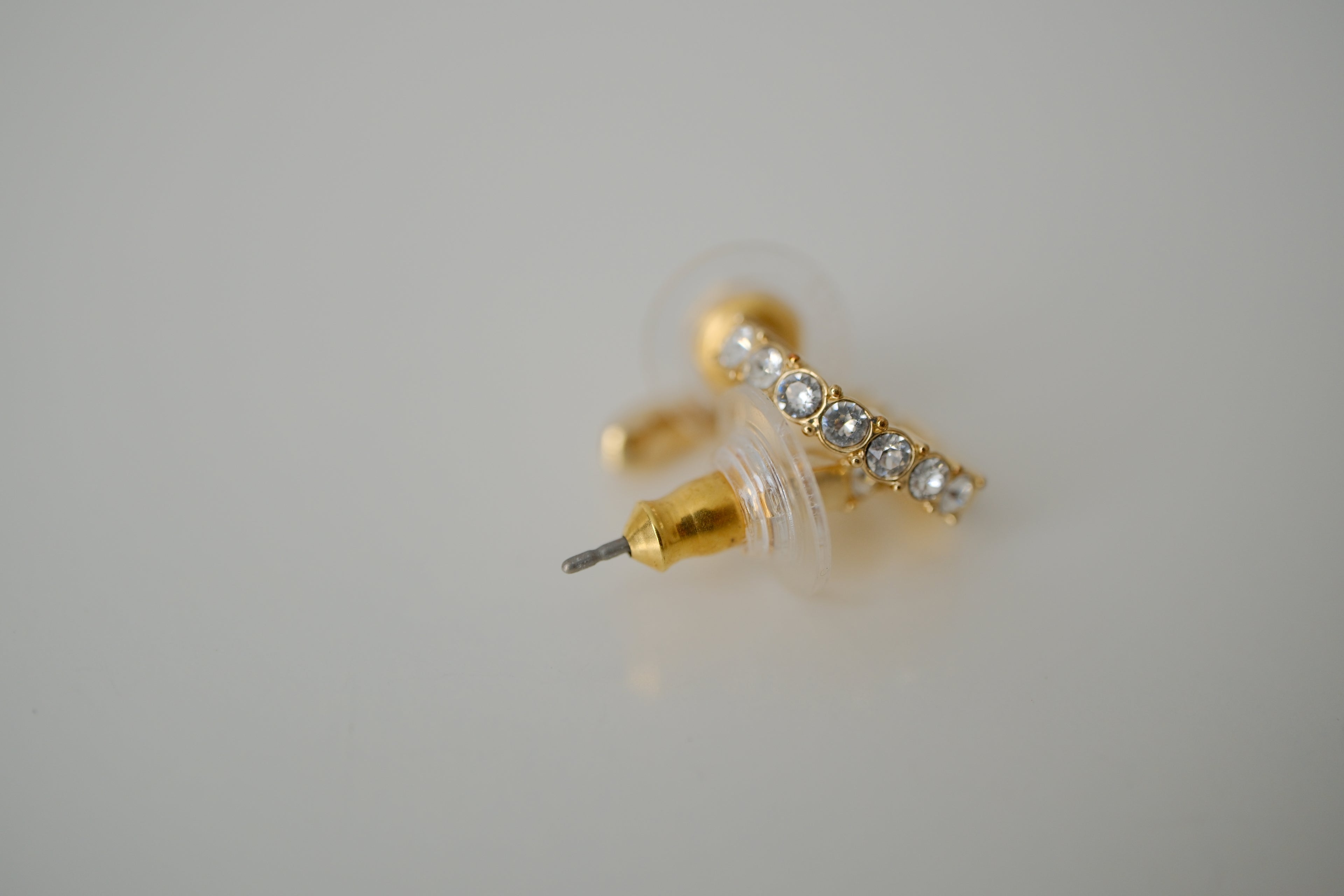 Gold curved bar stud earrings