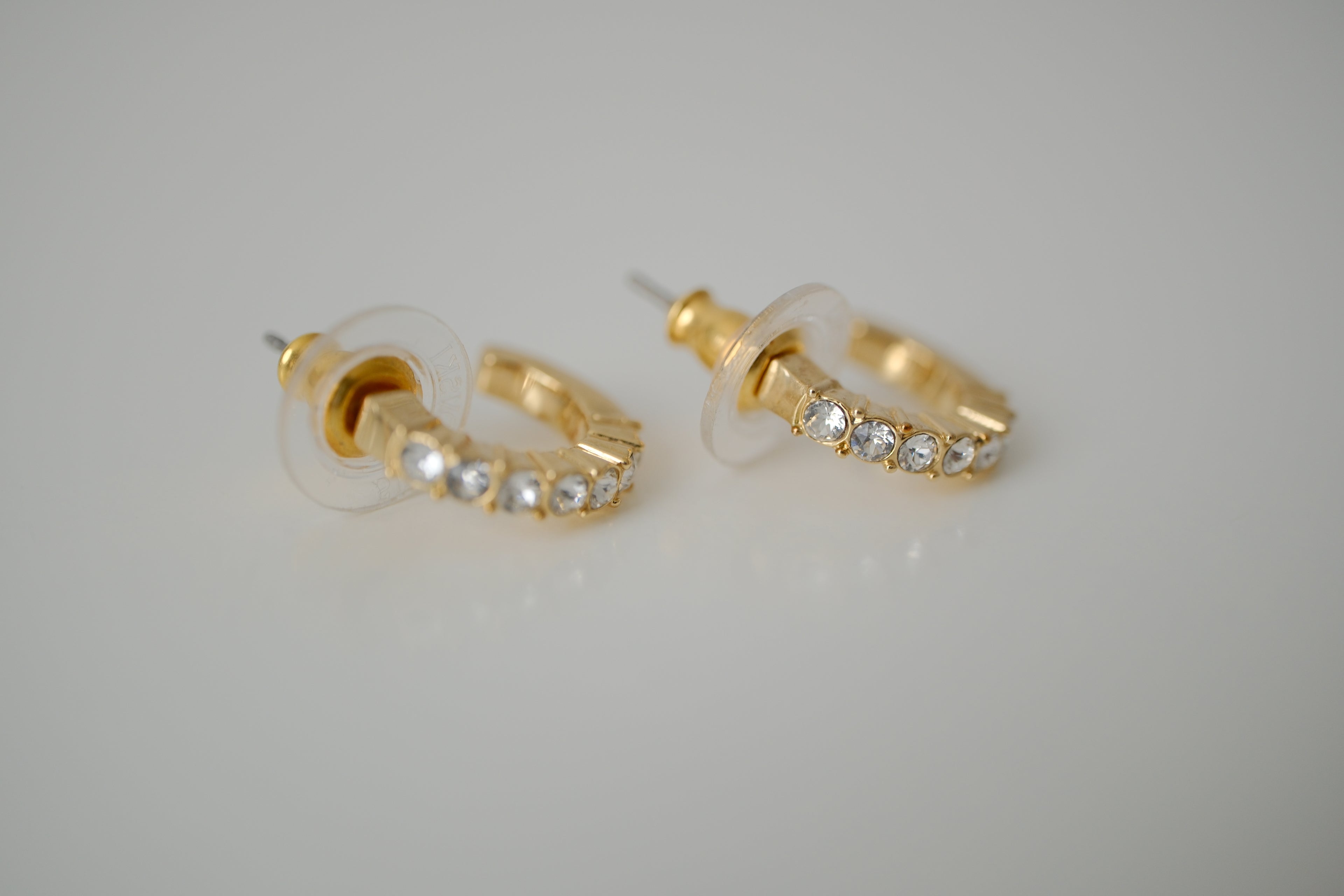 Gold curved bar stud earrings