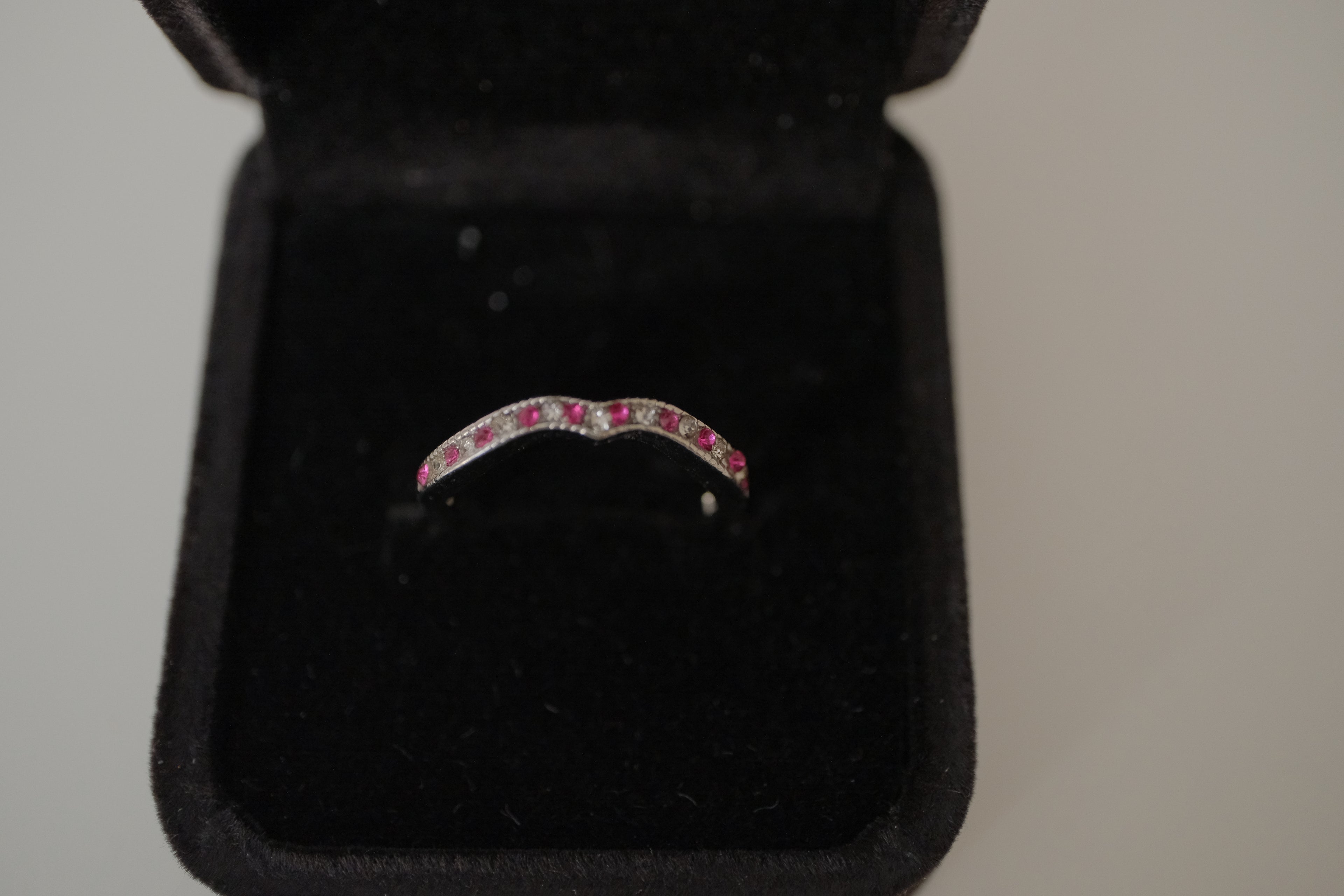 Silver tone pink and white curved "wishbone" ring