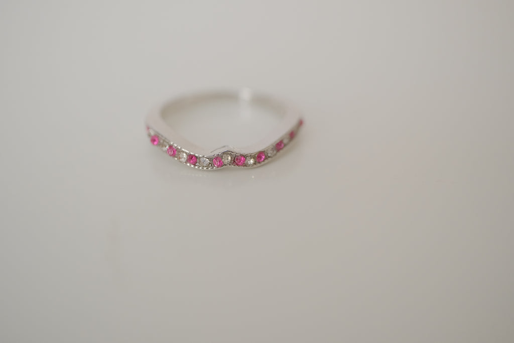 Silver tone pink and white curved "wishbone" ring