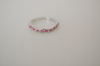 Silver tone pink and white curved "wishbone" ring