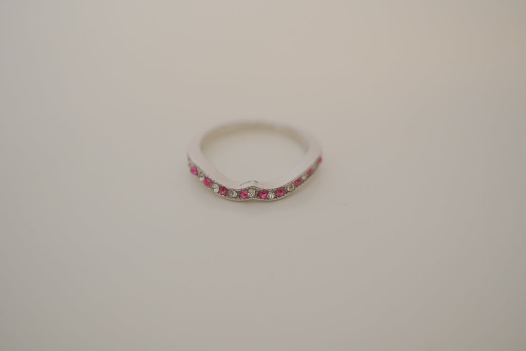 Silver tone pink and white curved "wishbone" ring