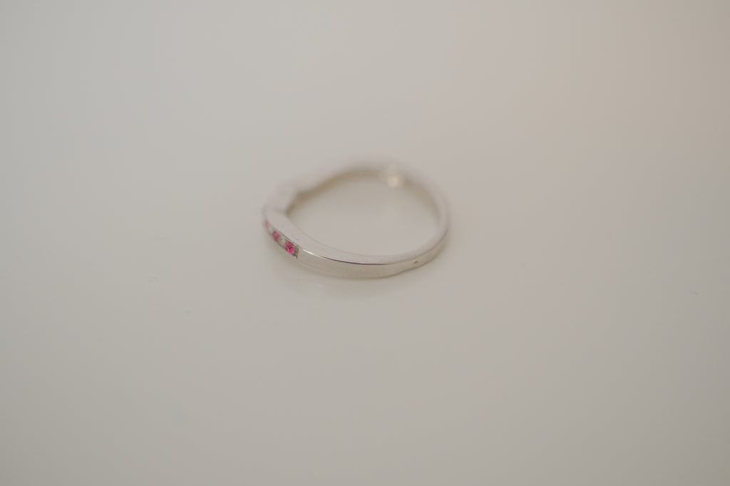Silver tone pink and white curved "wishbone" ring