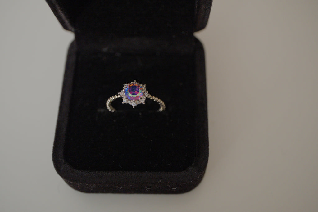 Silver tone iridescent stone ring
