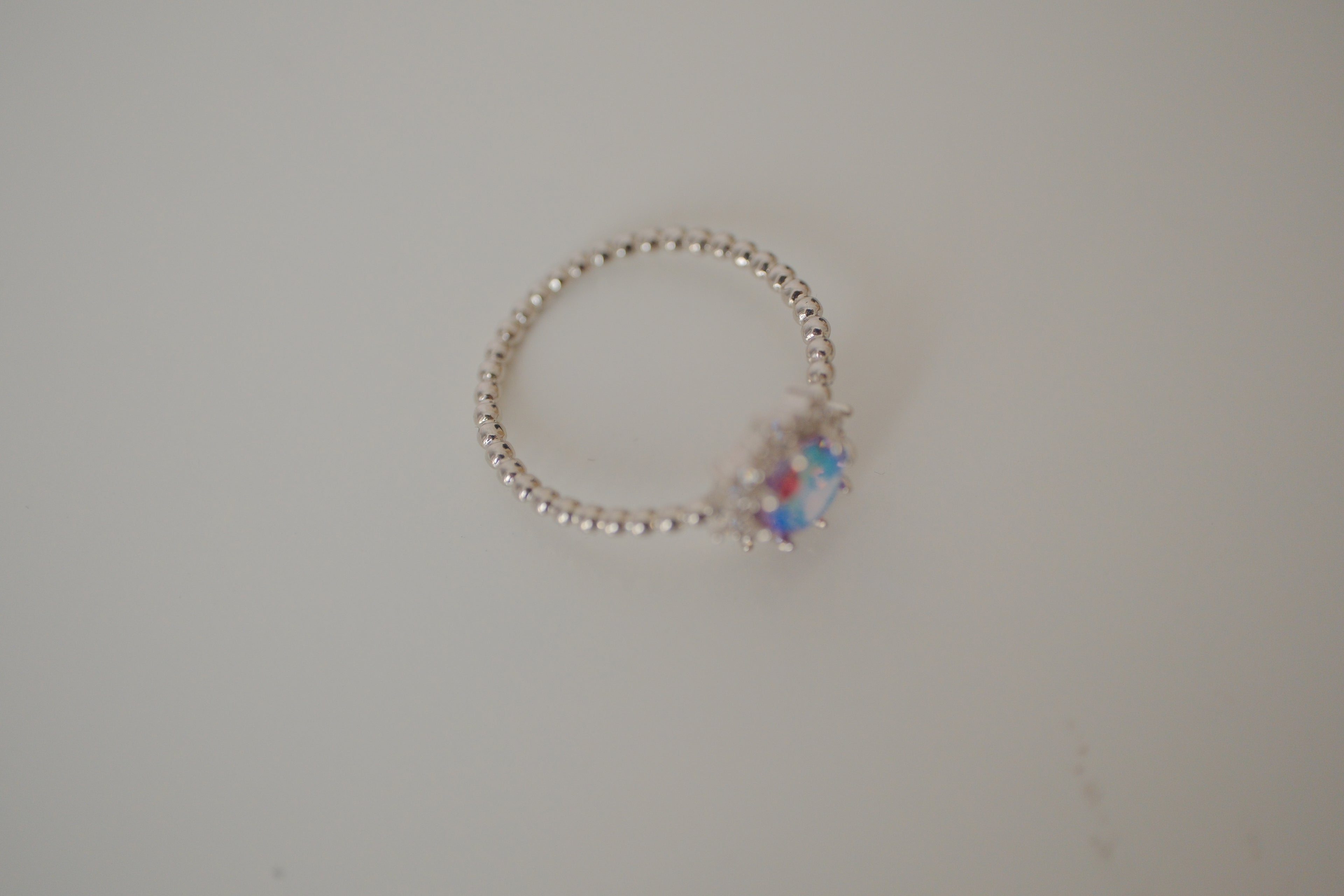Silver tone iridescent stone ring