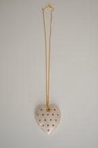 Ivory Heart pendant with gold studs