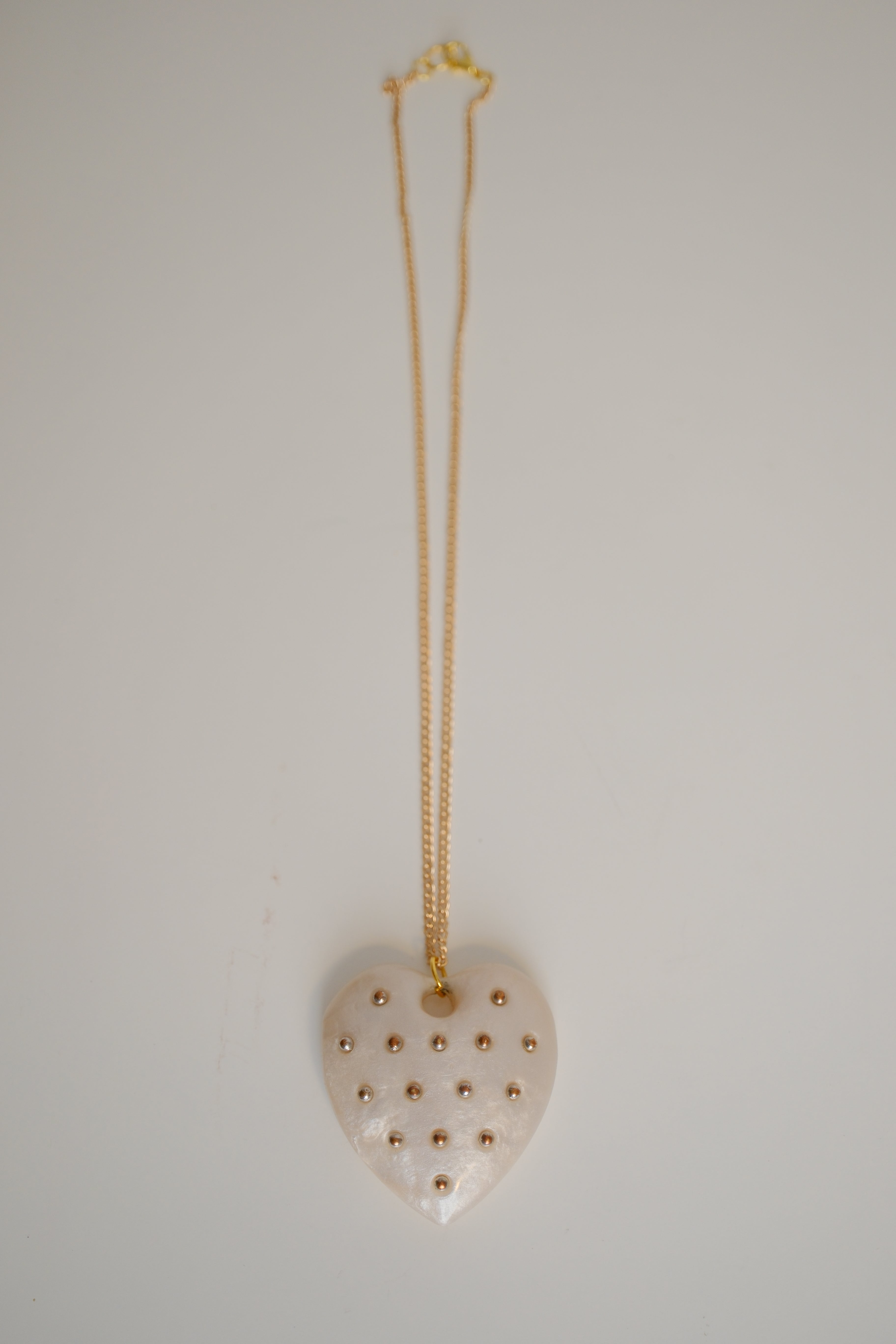 Ivory Heart pendant with gold studs