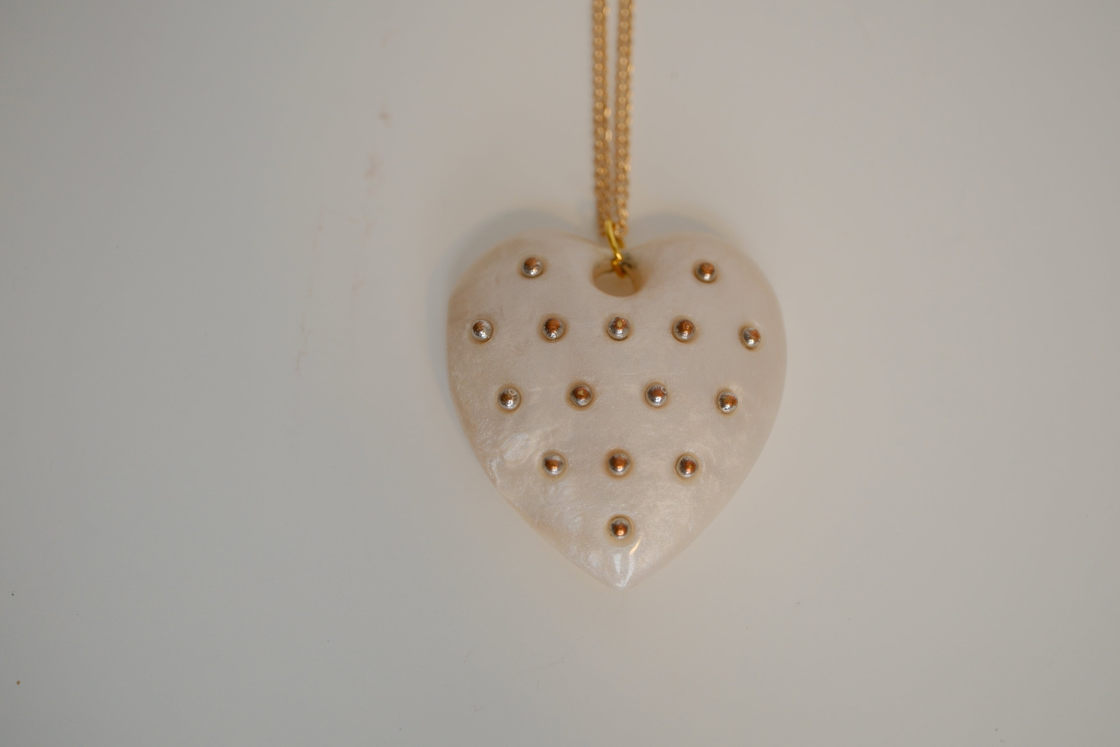 Ivory Heart pendant with gold studs