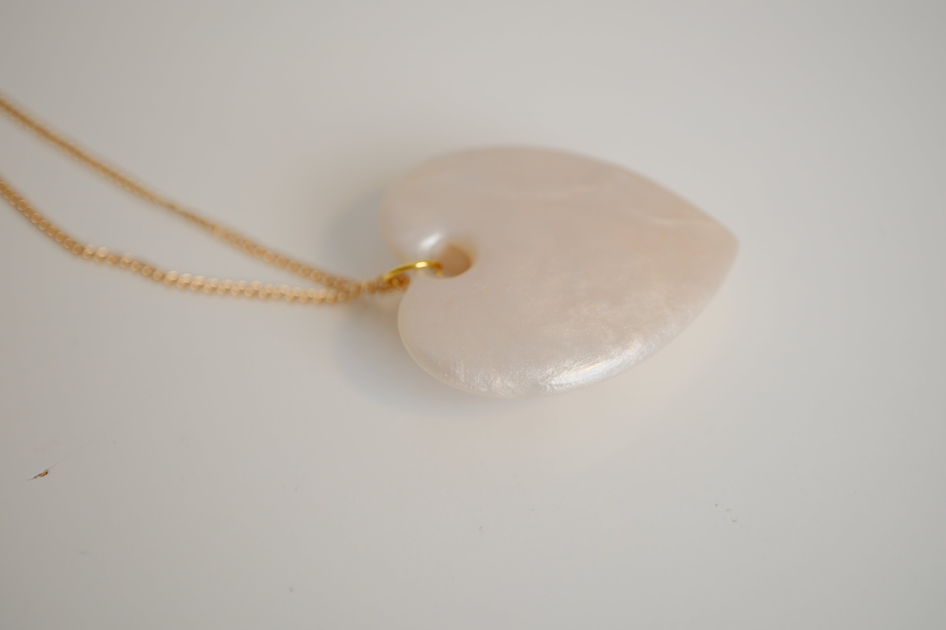 Ivory Heart pendant with gold studs