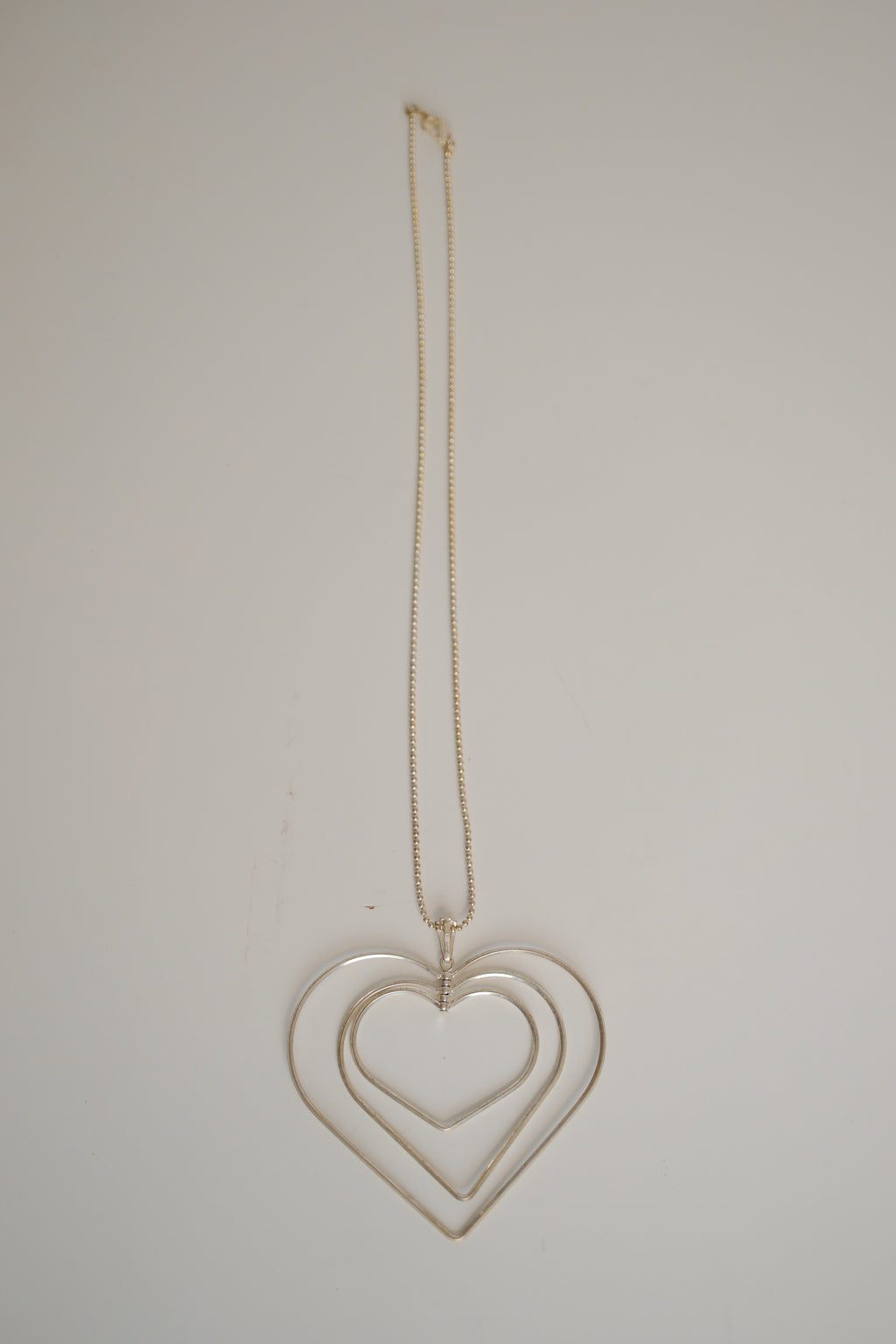 Triple-layered open heart pendant necklace