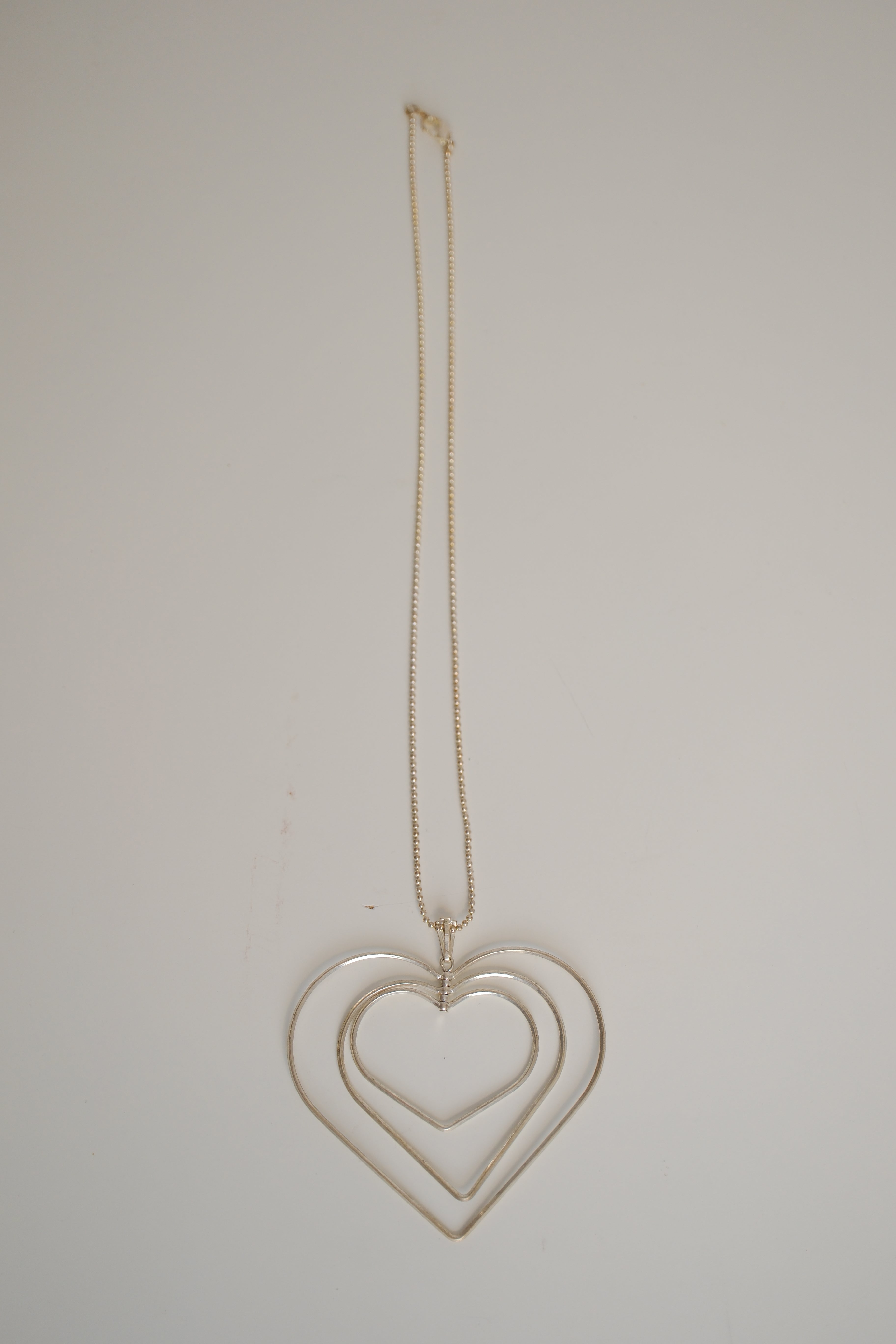 Triple-layered open heart pendant necklace