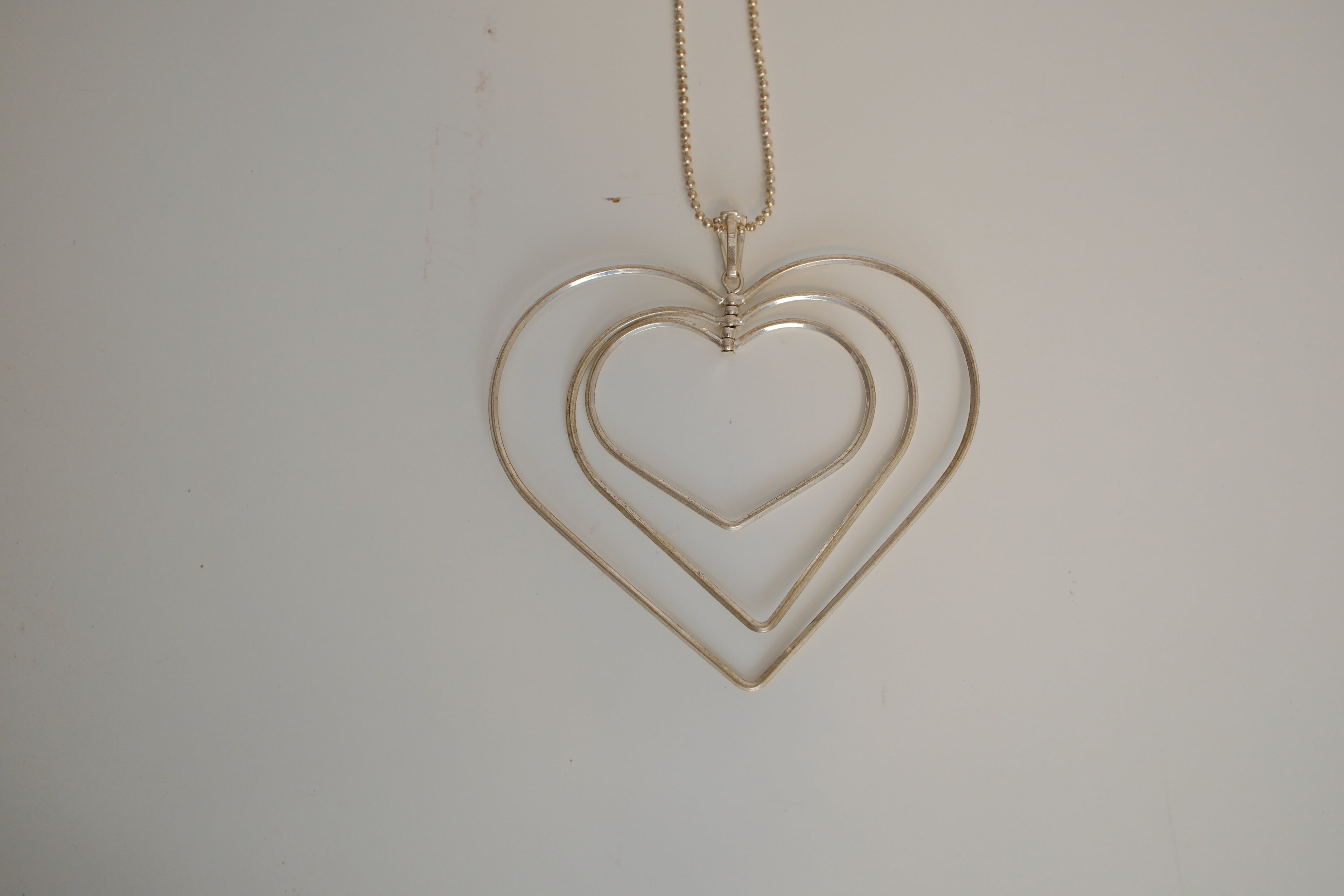 Triple-layered open heart pendant necklace