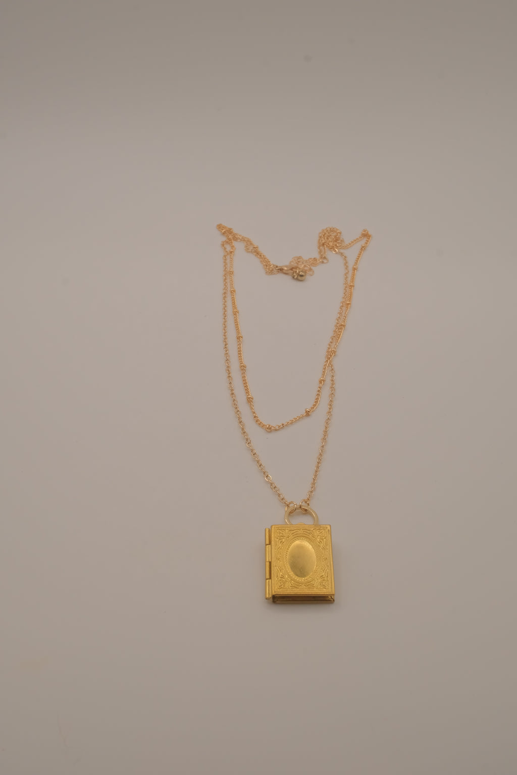 Layered gold book locket necklace