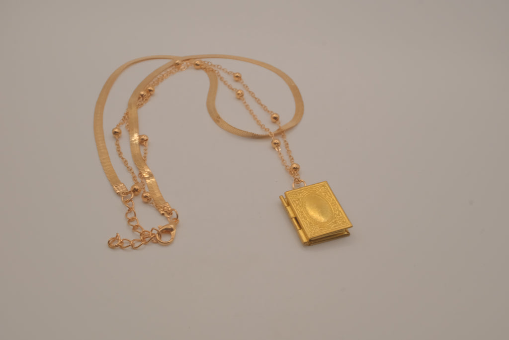 Layered Sleek and beaded chain with gold book locket pendant