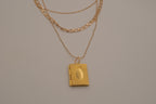 Multi strand gold book locket necklace