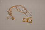Multi strand gold book locket necklace